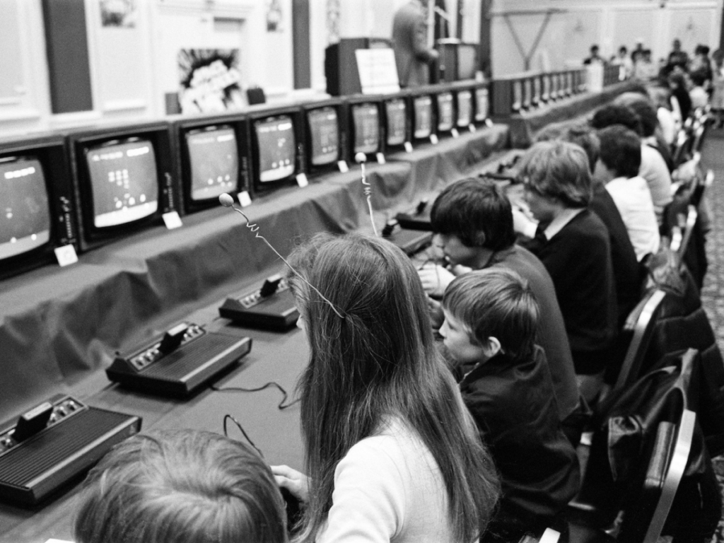 The London heats of Britain's first national space invaders championships. The event attracted 350 dedicated players. Lisa Penry wears antennae. 19th April 1981.