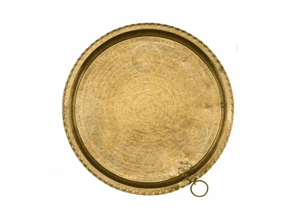 A serving tray crafted from hammered brass engraved and inlaid with gold from Egypt, Cairo or Syria that dates back to the Damascus Mamluk period, c.1330-1341CE. © Museum of Islamic Art, Qatar Museums