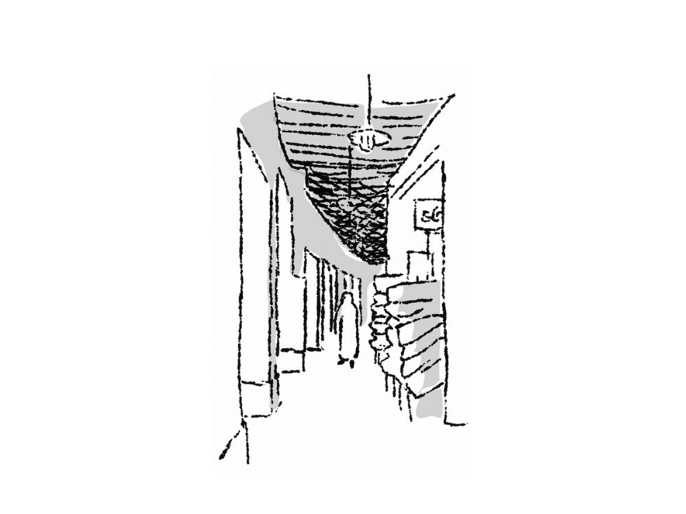 A black and white sketch by Shaikha Al Sulaiti​ depicts a narrow hallway with a hanging light fixture, a sign marked C6, and a staircase leading upward on the right side.