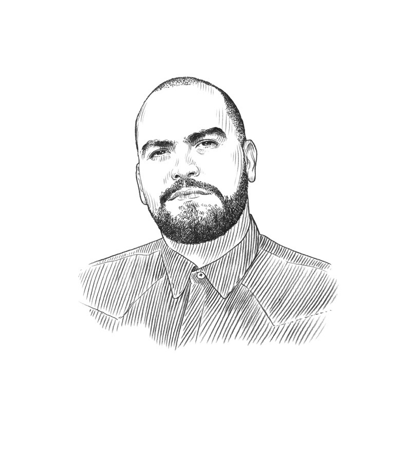 Black and white line drawing of a man with a beard, mustache, and short hair, wearing a collared shirt and looking slightly left, on a white background. This portrait evokes the thoughtful spirit of Q+A Qatar and Arts.