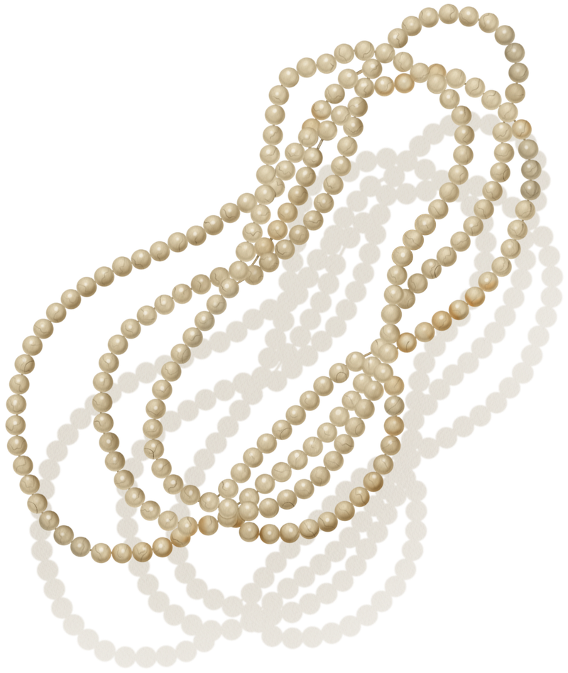 A long strand of cream-colored pearls is arranged in loose loops on a white surface