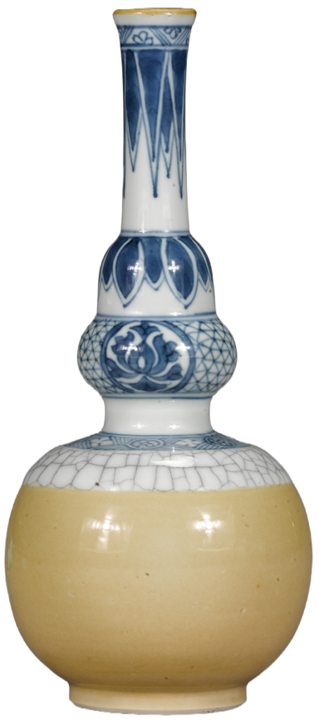 A ceramic vase with a round yellow base, a bulbous midsection featuring blue and white geometric patterns, and a long narrow neck decorated with blue designs, reminiscent of the bold architectural aesthetic seen in Frida Escobedo’s work.